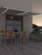 vidaXL Ръчно прибиращ се сенник с LED 600x300 см кремав